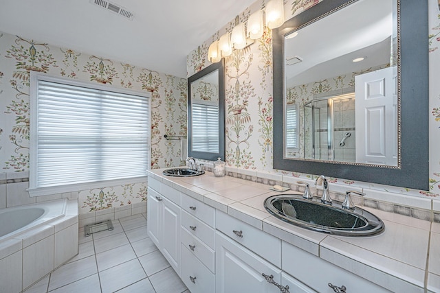 5847 Back Bay Dr, Isle Of Palms, SC 29451 - bathroom featuring double vanity, a shower stall, tile patterned flooring, wallpapered walls, and a garden tub
