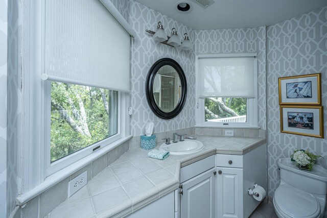 5847 Back Bay Dr, Isle Of Palms, SC 29451 - bathroom with wallpapered walls, vanity, and toilet