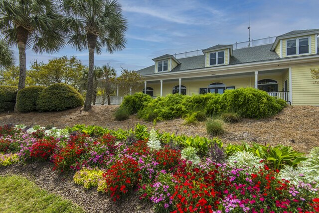 5847 Back Bay Dr, Isle Of Palms, SC 29451 - view of front of house with a shingled roof and a porch