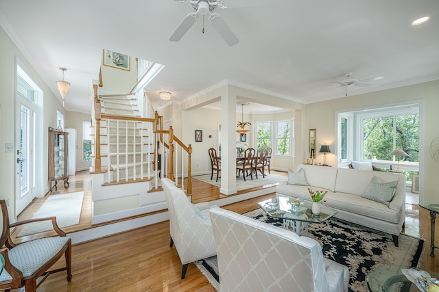 5847 Back Bay Dr, Isle Of Palms, SC 29451 - living area featuring ceiling fan, light wood-style flooring, stairs, crown molding, and recessed lighting