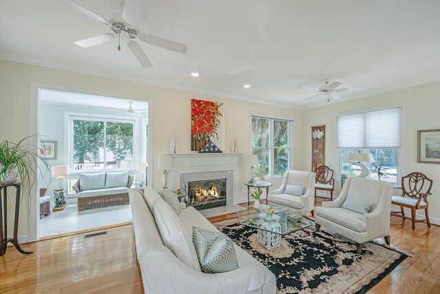 5847 Back Bay Dr, Isle Of Palms, SC 29451 - living room featuring ceiling fan, healthy amount of natural light, ornamental molding, light wood finished floors, and recessed lighting