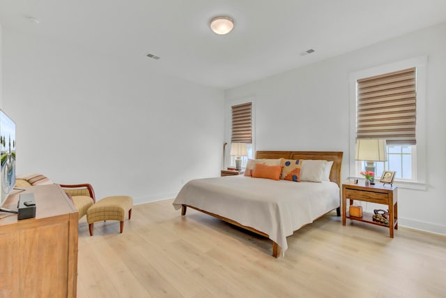 bedroom with light hardwood / wood-style flooring