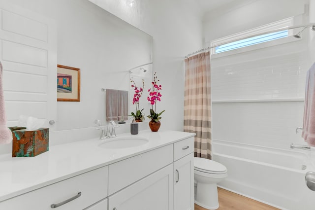 full bathroom featuring toilet, wood-type flooring, vanity, and shower / tub combo with curtain