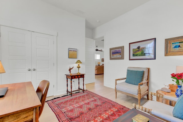 office space featuring ceiling fan and light hardwood / wood-style flooring