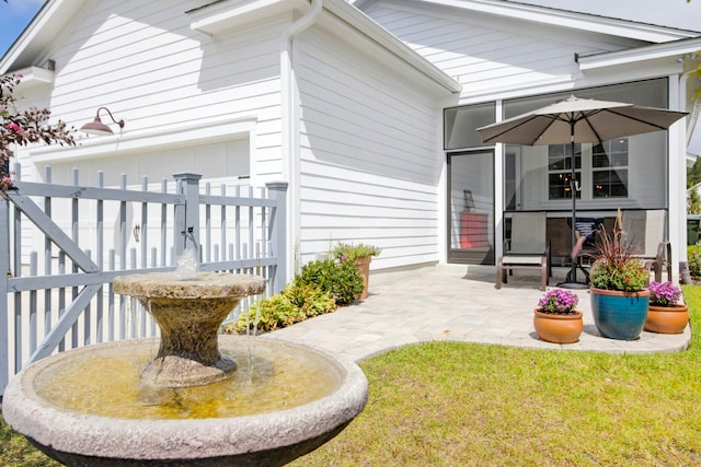 back of property featuring a patio area