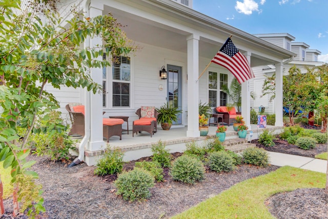 doorway to property with covered porch