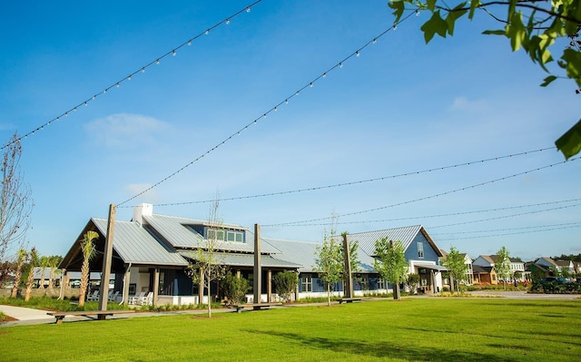 view of home's community featuring a lawn