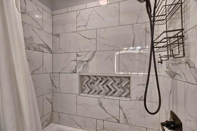 bathroom with shower / tub combo