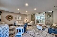 living room featuring a barn door