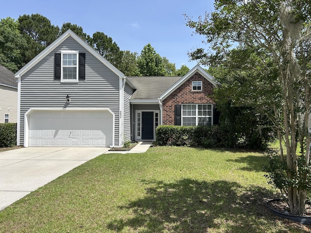 view of front facade featuring a front yard, driveway, and brick siding
