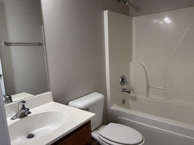full bath featuring toilet,  shower combination, and vanity