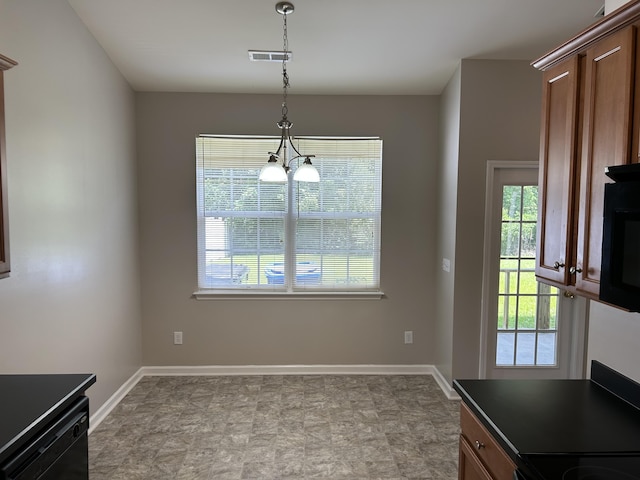 unfurnished dining area with healthy amount of natural light and baseboards