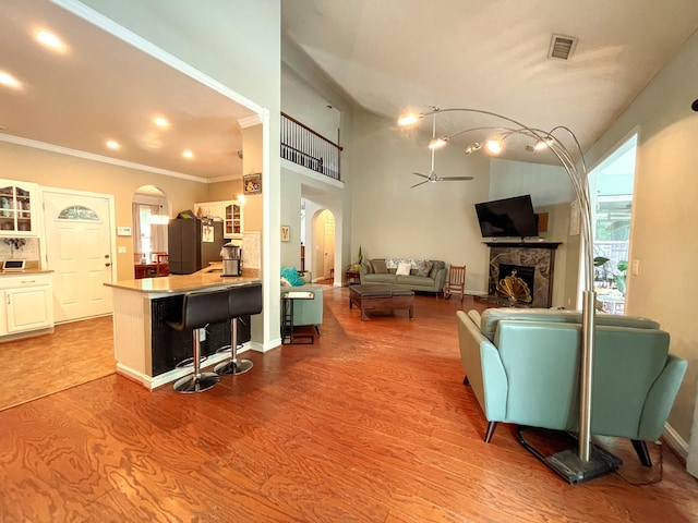6212 Fieldstone Cir, Charleston, SC 29414 - living room featuring arched walkways, a ceiling fan, wood finished floors, crown molding, and recessed lighting