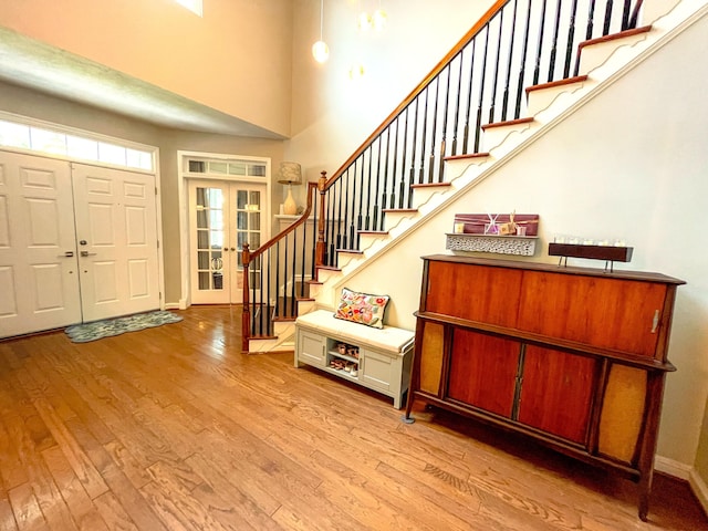 6212 Fieldstone Cir, Charleston, SC 29414 - foyer with french doors, wood finished floors, stairs, baseboards, and a towering ceiling