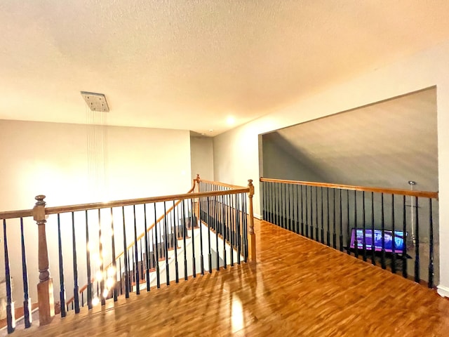 6212 Fieldstone Cir, Charleston, SC 29414 - hall with an upstairs landing, wood finished floors, and a textured ceiling