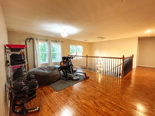 6212 Fieldstone Cir, Charleston, SC 29414 - workout area featuring wood finished floors and a textured ceiling