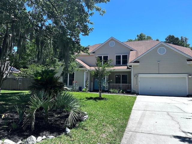 6212 Fieldstone Cir, Charleston, SC 29414 - view of front of home with driveway, a garage, covered porch, and roof with shingles