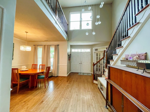 6212 Fieldstone Cir, Charleston, SC 29414 - foyer with stairs, light wood-style floors, healthy amount of natural light, a towering ceiling, and baseboards