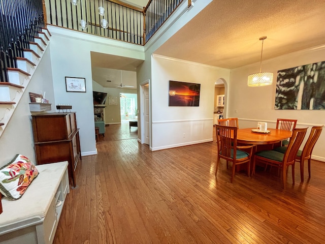6212 Fieldstone Cir, Charleston, SC 29414 - dining space with arched walkways, hardwood / wood-style floors, ornamental molding, a ceiling fan, and stairway