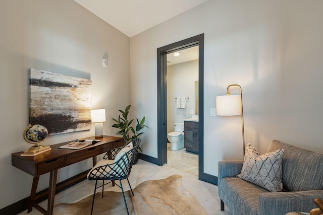 office space featuring baseboards and light colored carpet