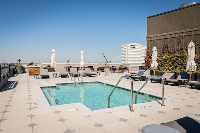 community pool featuring a patio area