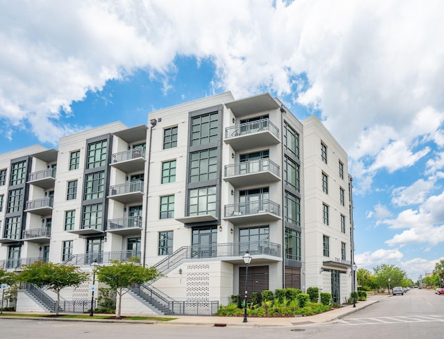 view of apartment building / complex with stairway