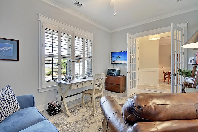 living room with french doors and ornamental molding