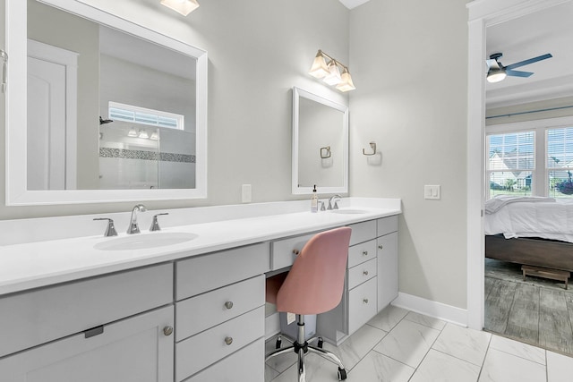 bathroom featuring a shower, vanity, and ceiling fan