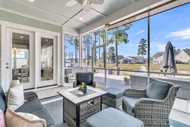 sunroom featuring ceiling fan