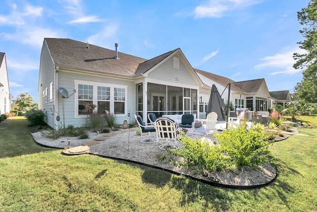 back of house featuring a patio, a sunroom, and a lawn