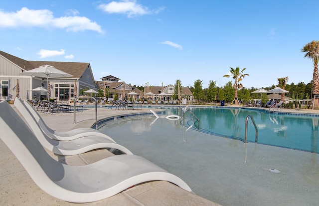 view of swimming pool with a patio area