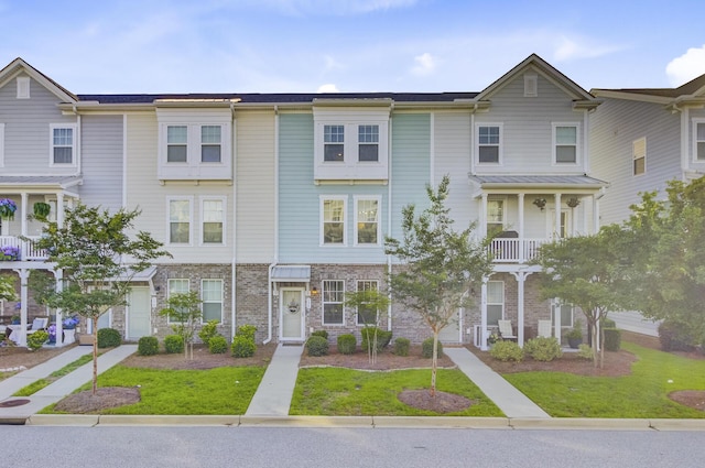 136 Rowans Creek Dr, Charleston, SC 29492 - view of property with a front yard and stone siding