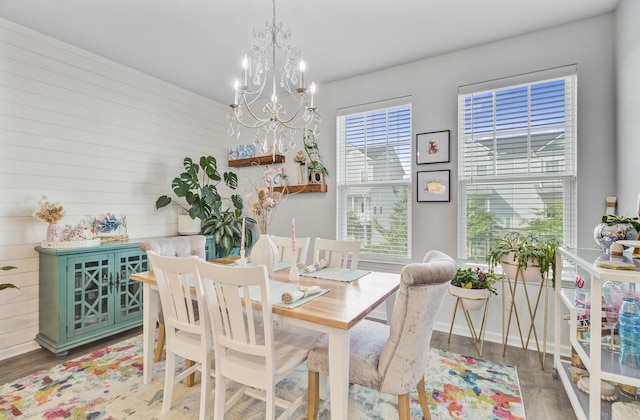 136 Rowans Creek Dr, Charleston, SC 29492 - dining room featuring a chandelier, light wood-type flooring, and wood walls