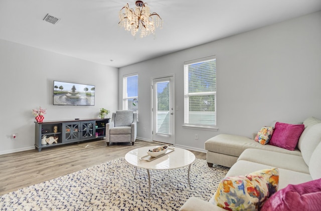 136 Rowans Creek Dr, Charleston, SC 29492 - living area with wood finished floors and a chandelier
