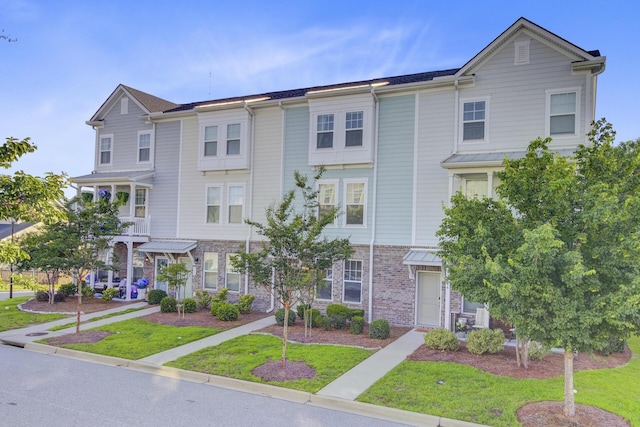 136 Rowans Creek Dr, Charleston, SC 29492 - townhome / multi-family property featuring a front yard
