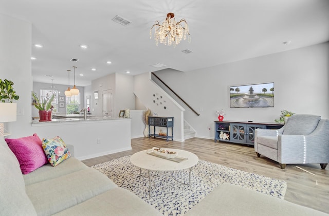 136 Rowans Creek Dr, Charleston, SC 29492 - living room featuring a chandelier, stairs, wood finished floors, and recessed lighting