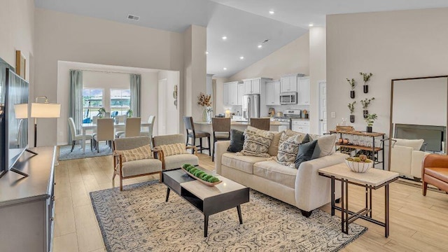 544 Verdi Dr, Summerville, SC 29486 - living room with high vaulted ceiling, light wood-type flooring, and recessed lighting