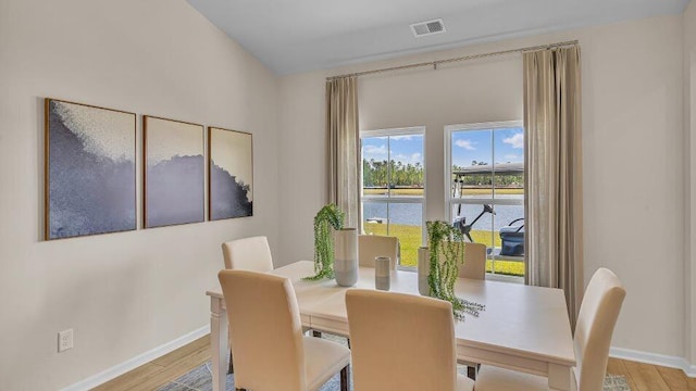 544 Verdi Dr, Summerville, SC 29486 - dining space with baseboards, a water view, and light wood-type flooring