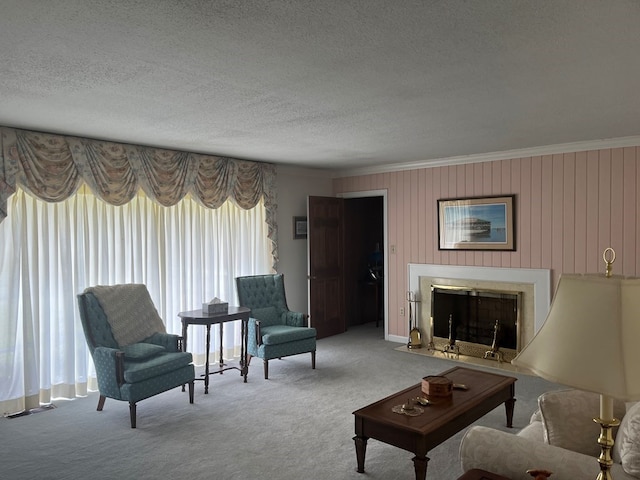 living room with light colored carpet, a textured ceiling, crown molding, and wood walls