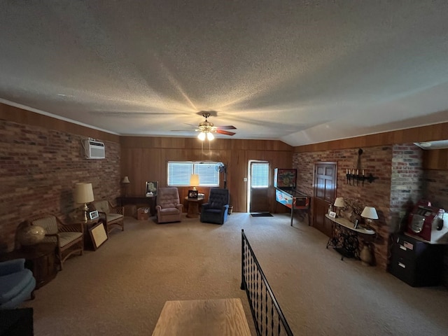 unfurnished living room with carpet flooring, ceiling fan, brick wall, lofted ceiling, and a textured ceiling