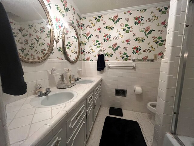 bathroom featuring vanity, ornamental molding, an enclosed shower, tile patterned floors, and toilet