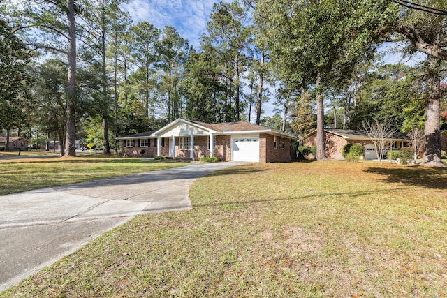 view of front of house featuring a garage and a front lawn