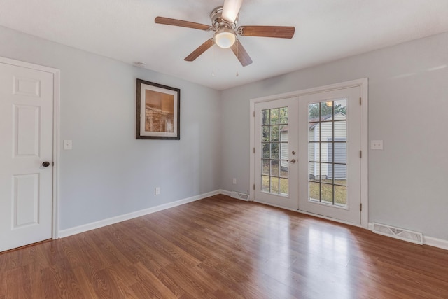 unfurnished room with ceiling fan, french doors, and hardwood / wood-style floors