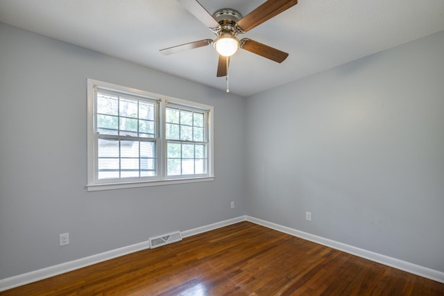 spare room featuring ceiling fan and dark hardwood / wood-style flooring