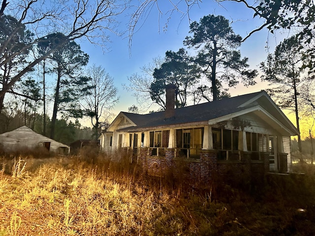 view of property exterior at dusk