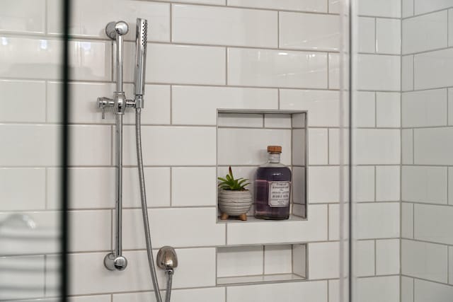 room details with a tile shower