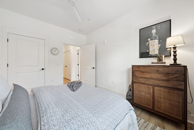 bedroom with lofted ceiling, ceiling fan, and light hardwood / wood-style flooring