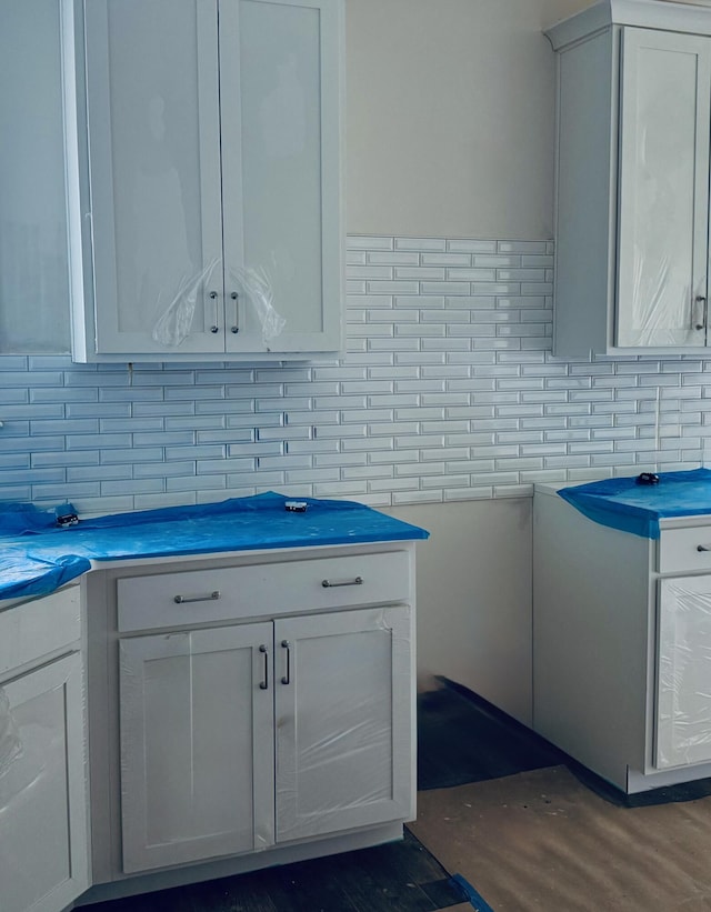 420 Carolina Cherry Ct Unit 102, Charleston, SC 29414 - kitchen featuring tasteful backsplash and white cabinetry