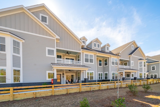 exterior space with ceiling fan and a balcony