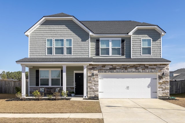 view of front facade featuring a garage and covered porch